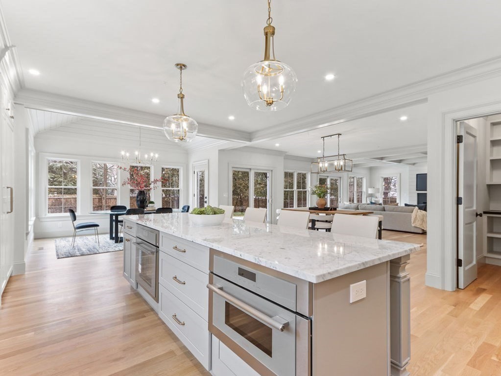 31 Karen Road Newton, MA 02468 - Photo 7 of 41 a large kitchen with kitchen island a stove a sink a center island and wooden floor