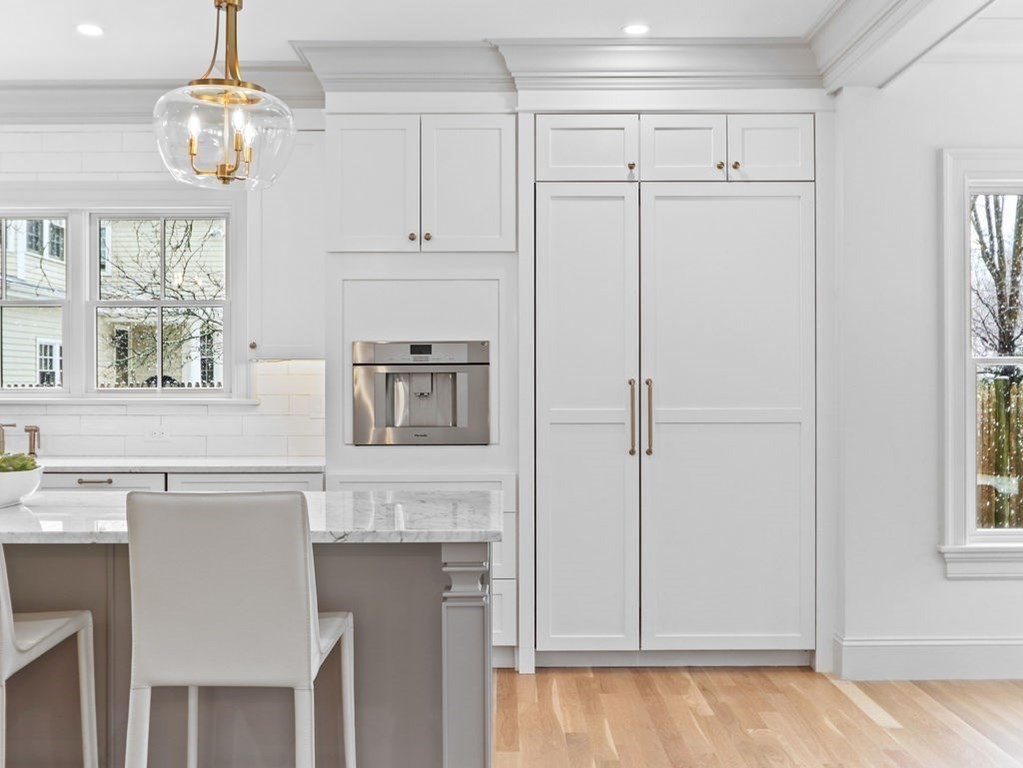 31 Karen Road Newton, MA 02468 - Photo 9 of 41 a kitchen with cabinets stainless steel appliances and chandelier