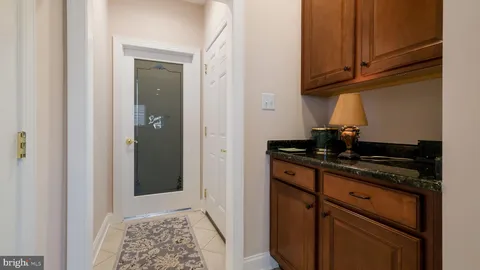 a kitchen with stainless steel appliances granite countertop a stove and a microwave