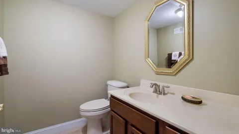 a room with pool table and windows