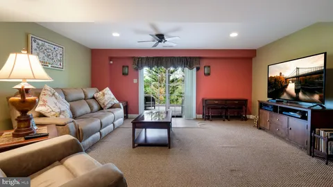 a view of a livingroom with furniture and toys