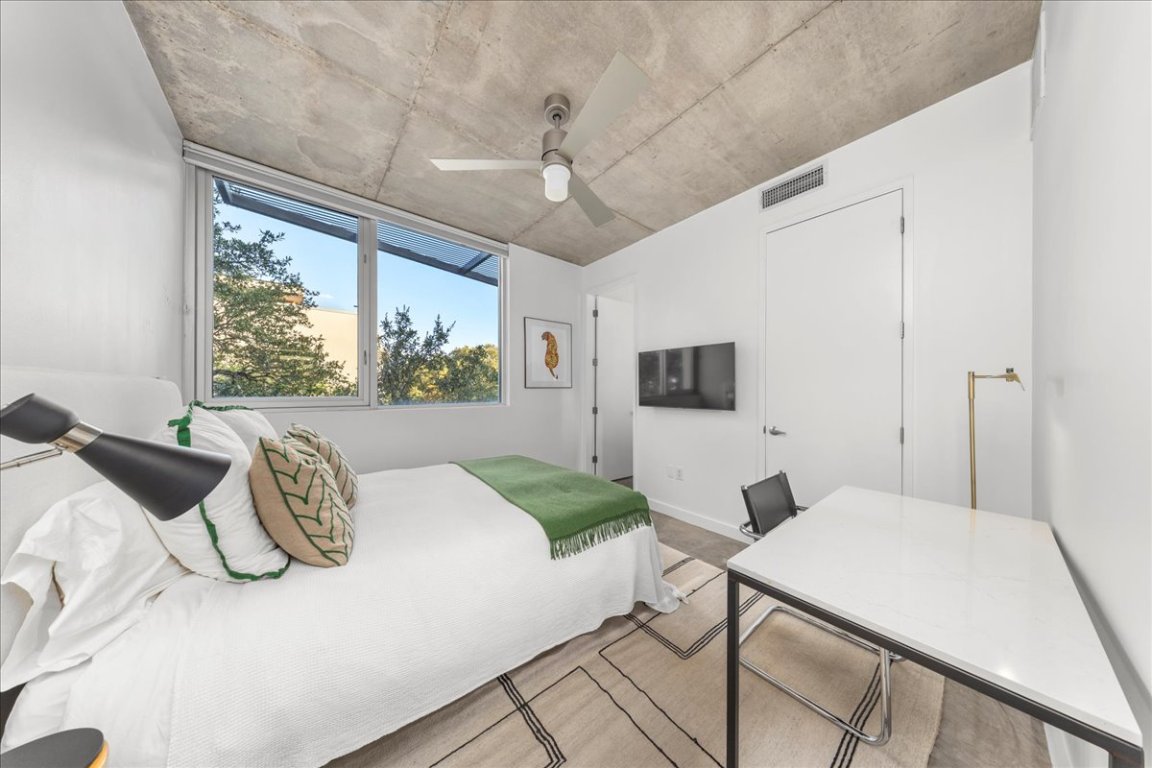 2301 South 5th Street, Unit 6 Austin, TX 78704 - Photo 21 of 40 a bedroom with a bed and a large window