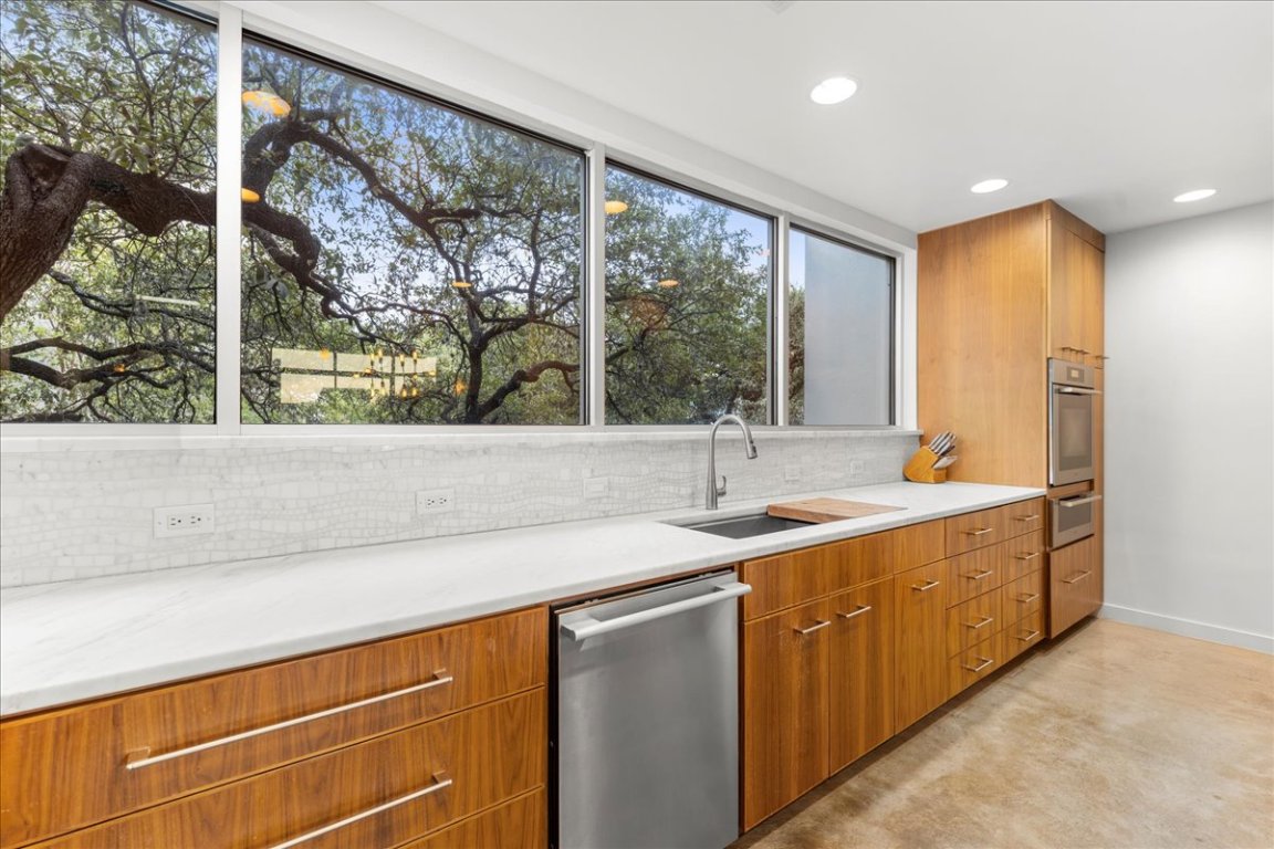 2301 South 5th Street, Unit 6 Austin, TX 78704 - Photo 8 of 40 a kitchen with a sink and large window