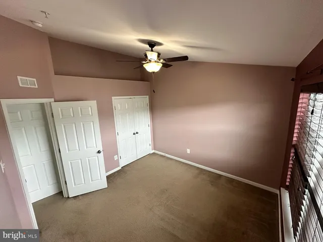 an empty room with a mirror