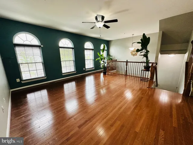 a view of an entryway with wooden floor