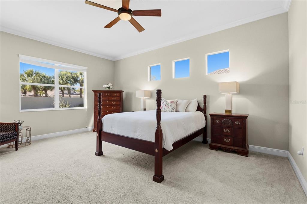 357 Marsh Creek Road Venice, FL 34292 - Photo 25 of 70 a bedroom with a bed dresser and a window