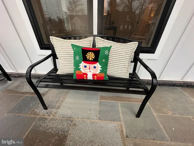 a view of a dining room and livingroom with furniture wooden floor a chandelier