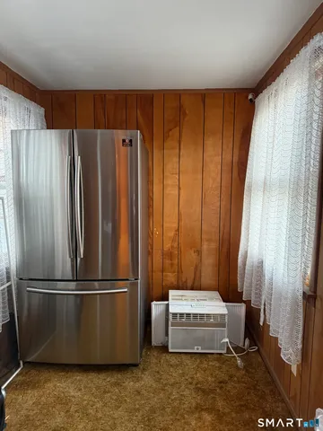 a refrigerator freezer sitting in a kitchen