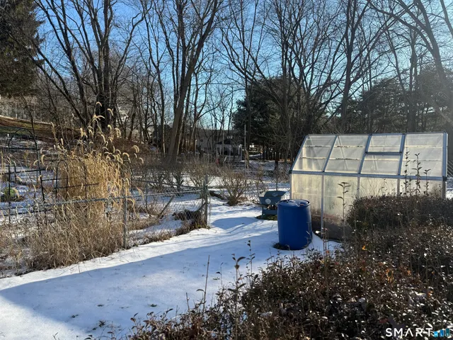 a view of a outdoor space with a patio and lake view