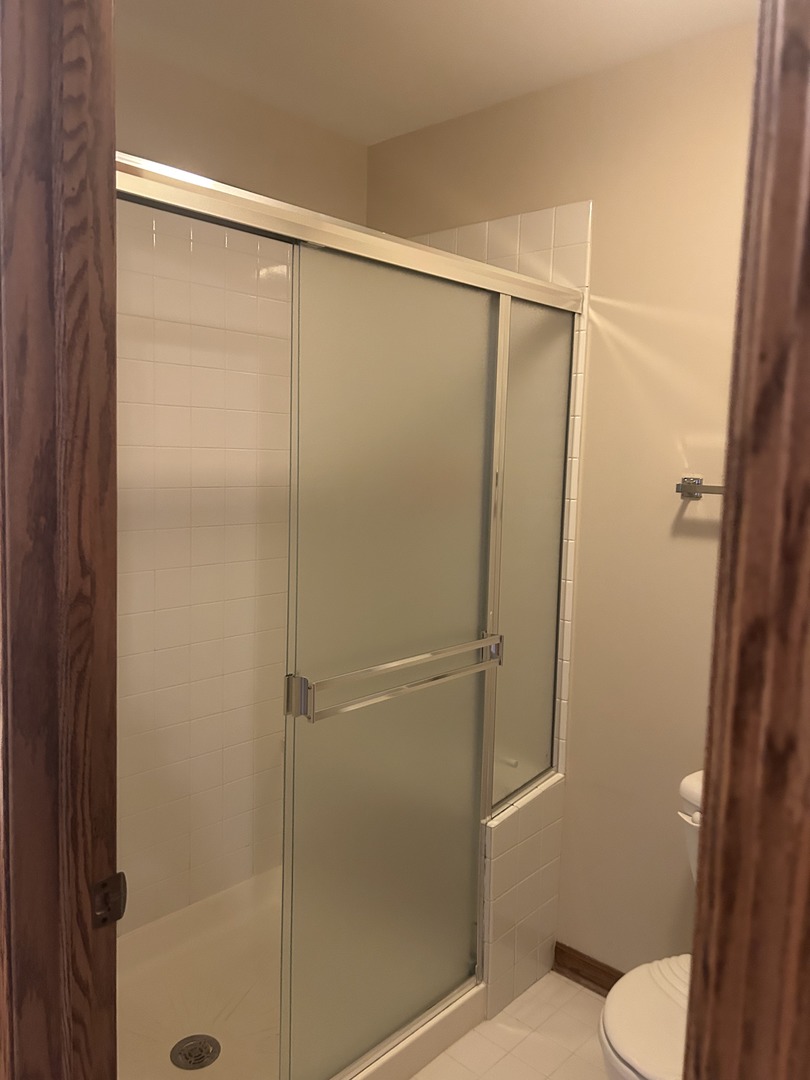 527 Springwood Lane Bolingbrook, IL 60440 - Photo 25 of 35 a bathroom with a shower and a toilet