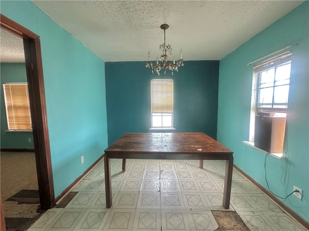 801 Ruben Chavez Road Robstown, TX 78380 - Photo 6 of 18 a room with window and wooden floor