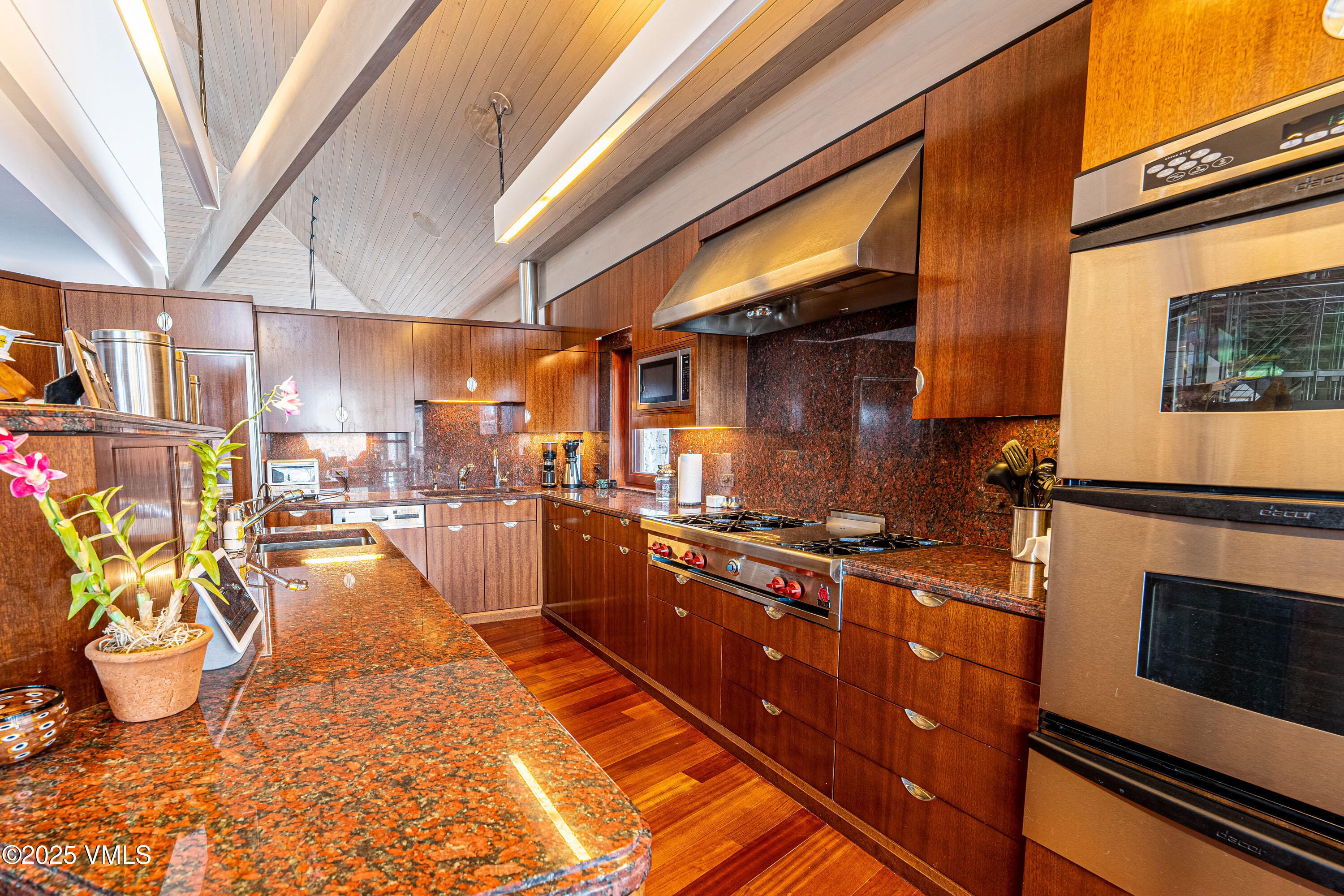 56 Rose Crown Avon, CO 81620 - Photo 12 of 39 a kitchen with stainless steel appliances a stove a sink and a refrigerator