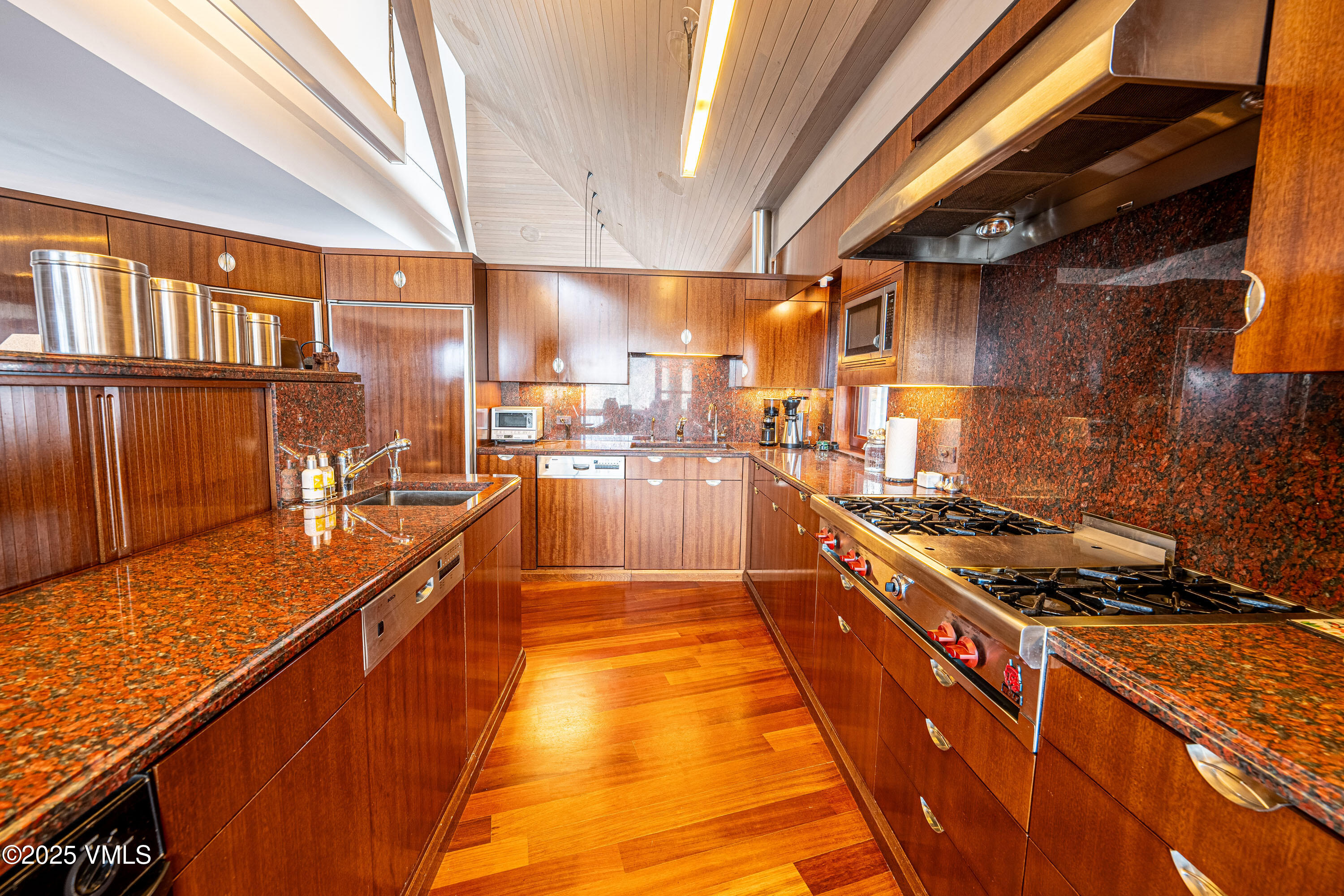 56 Rose Crown Avon, CO 81620 - Photo 13 of 39 a kitchen with stainless steel appliances granite countertop a stove a sink and a refrigerator