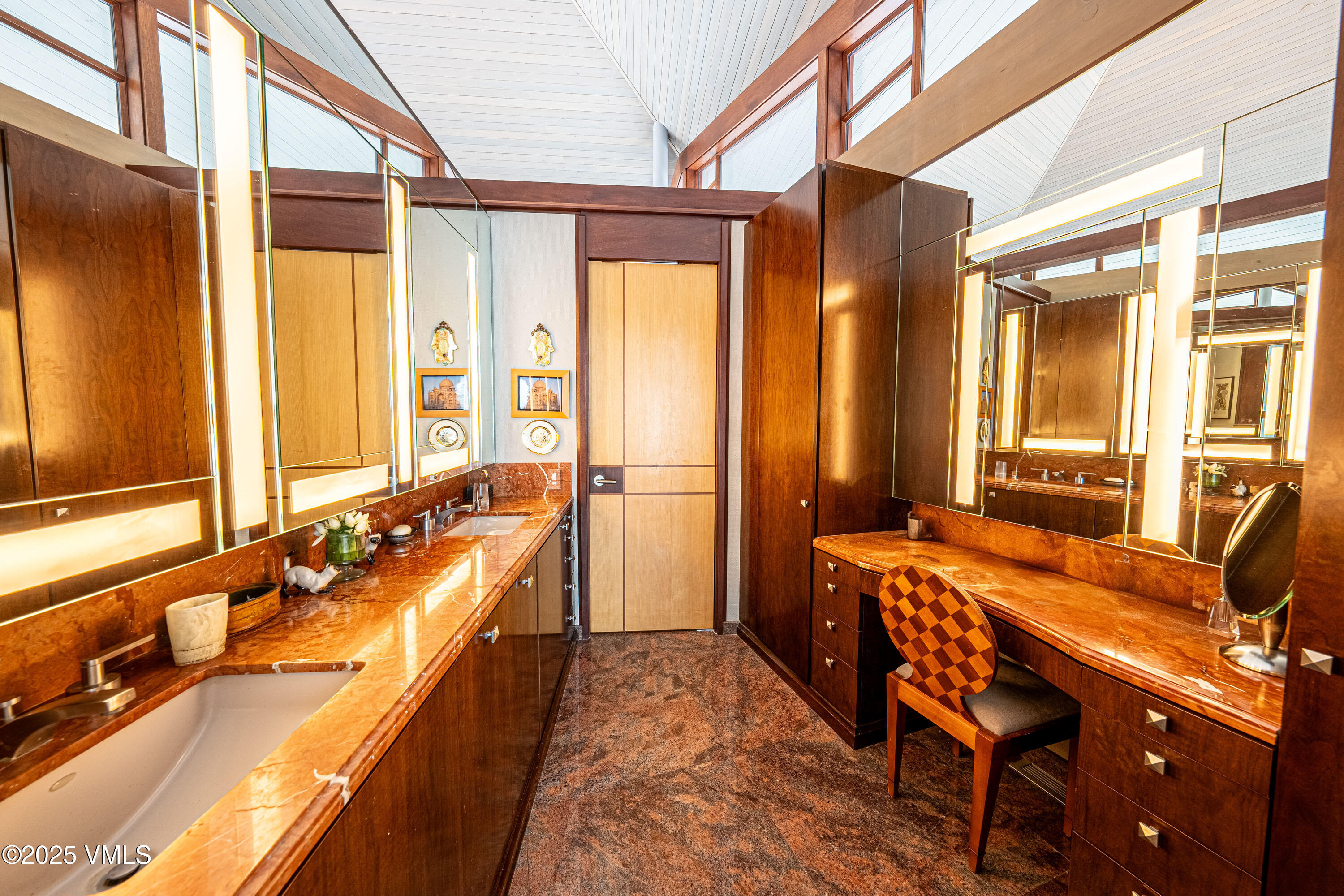 56 Rose Crown Avon, CO 81620 - Photo 17 of 39 a bathroom with a tub a sink and a large mirror next to a window