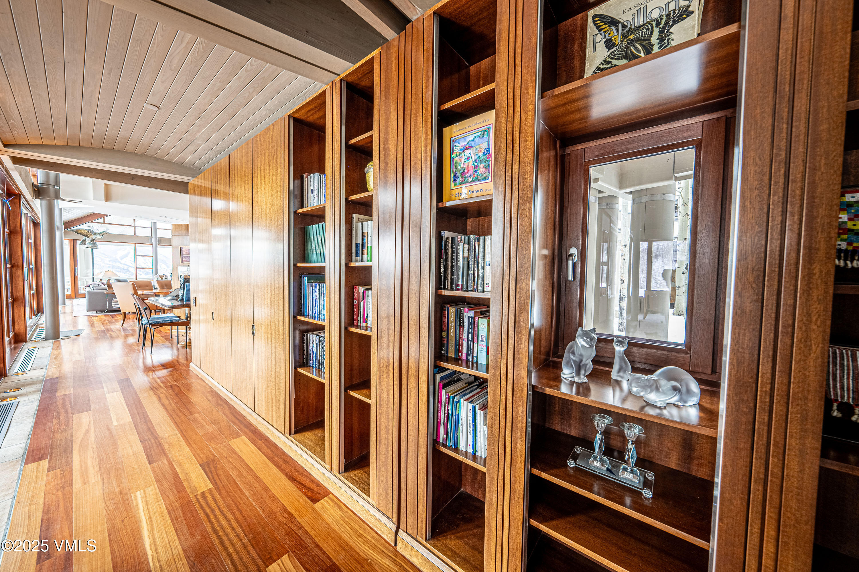 56 Rose Crown Avon, CO 81620 - Photo 19 of 39 a view of a hallway with wooden floor and furniture