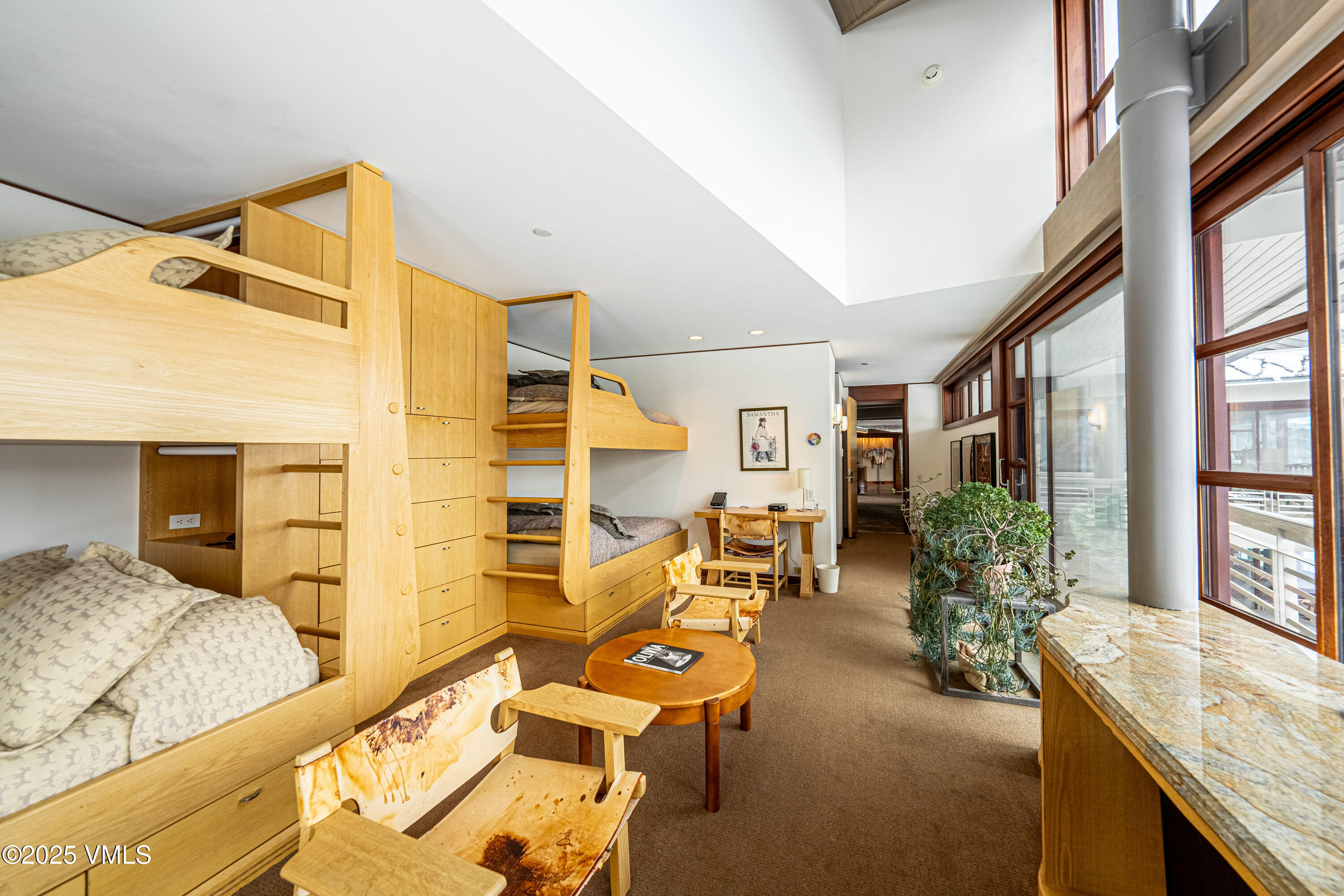 56 Rose Crown Avon, CO 81620 - Photo 21 of 39 a bedroom with furniture and a large window