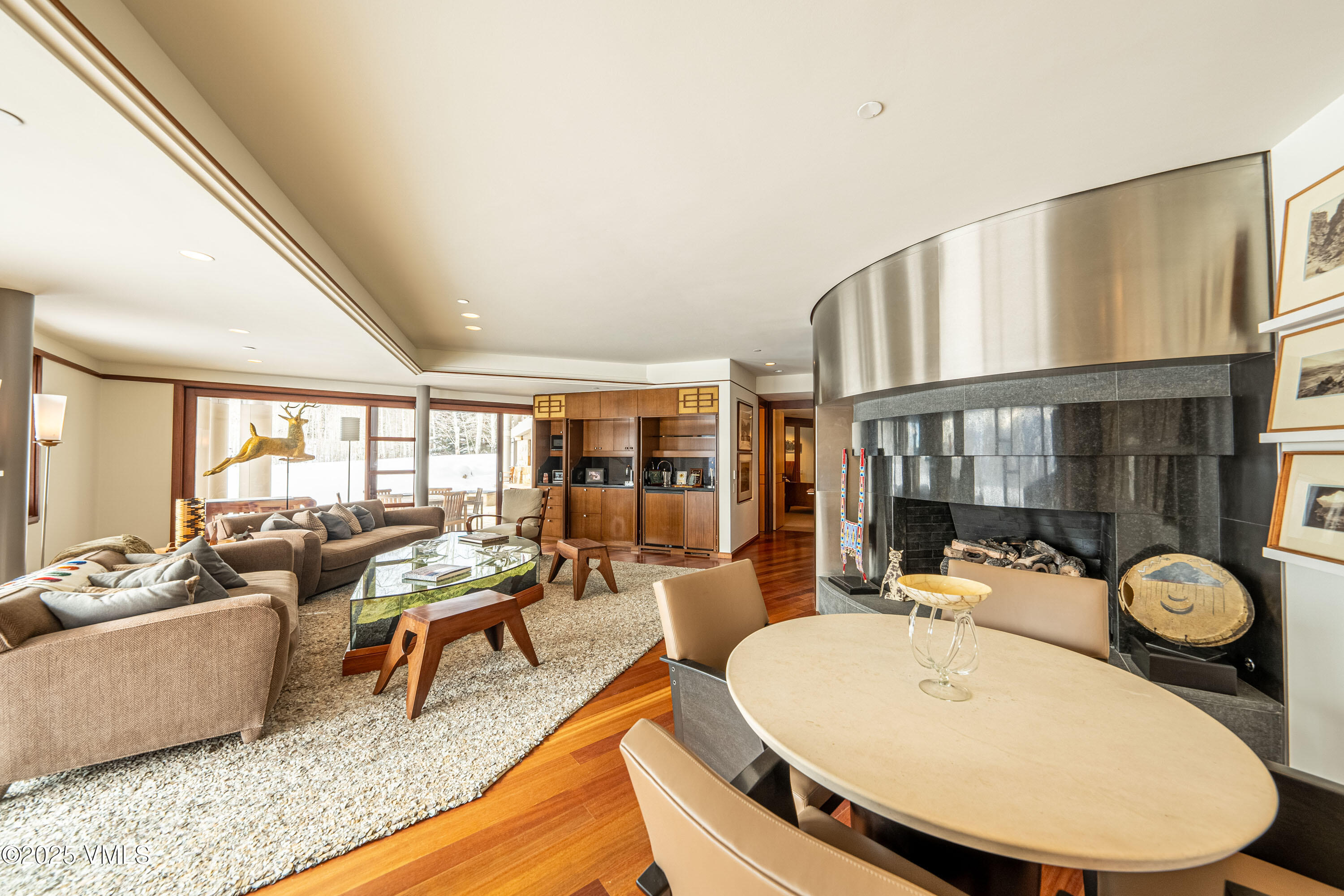 56 Rose Crown Avon, CO 81620 - Photo 30 of 39 a living room with furniture a fireplace and a large window