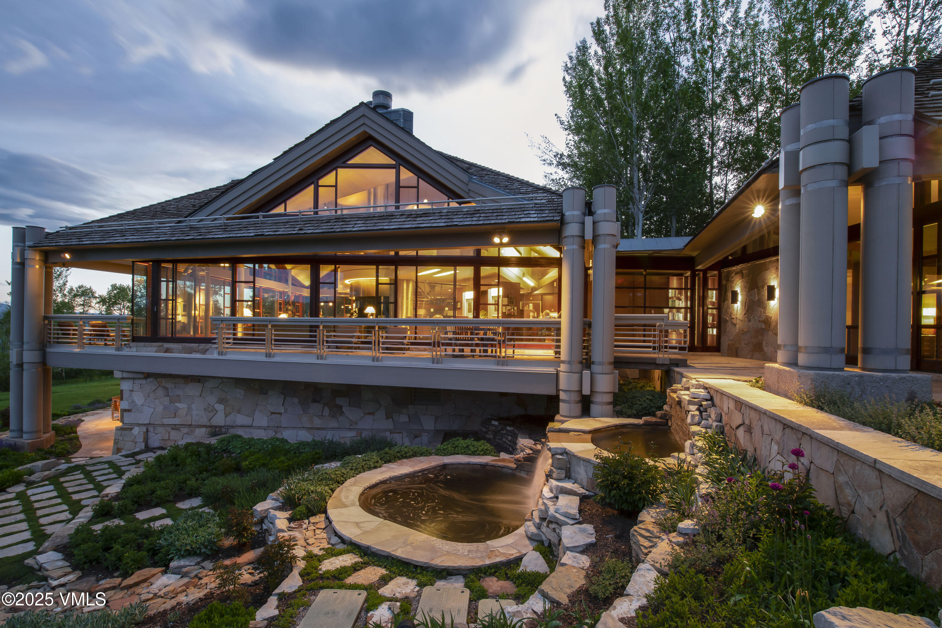 56 Rose Crown Avon, CO 81620 - Photo 34 of 39 a backyard of a house with lake view and a potted plant
