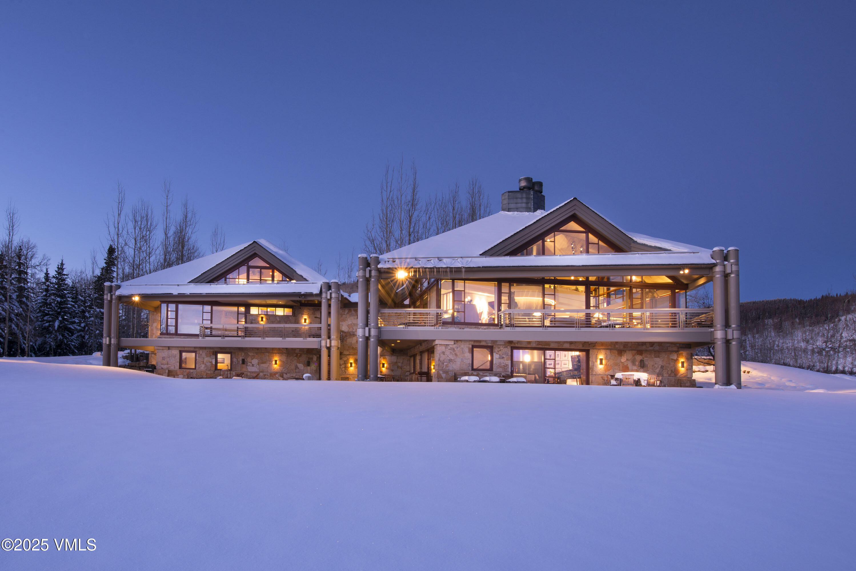 56 Rose Crown Avon, CO 81620 - Photo 39 of 39 a view of a house with large windows and a yard