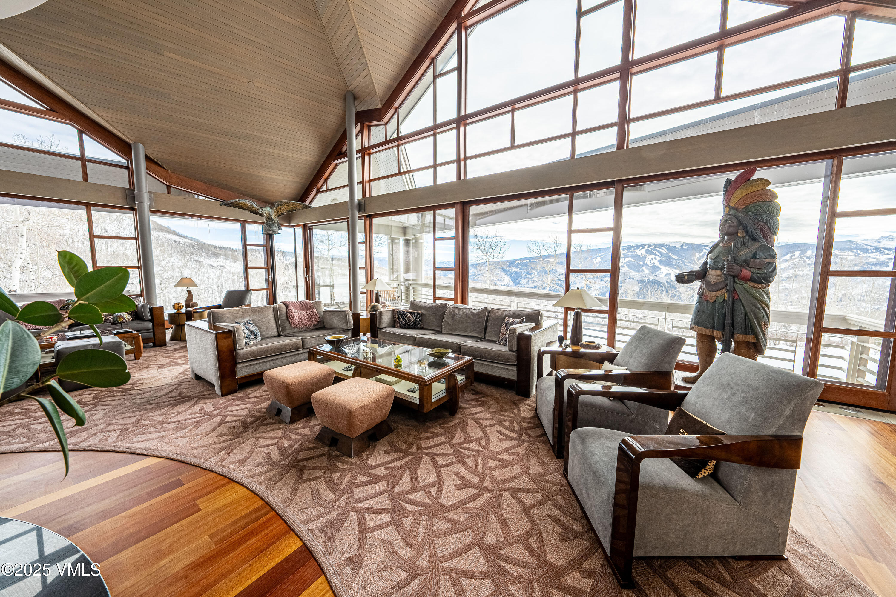56 Rose Crown Avon, CO 81620 - Photo 7 of 39 a living room with furniture and floor to ceiling windows