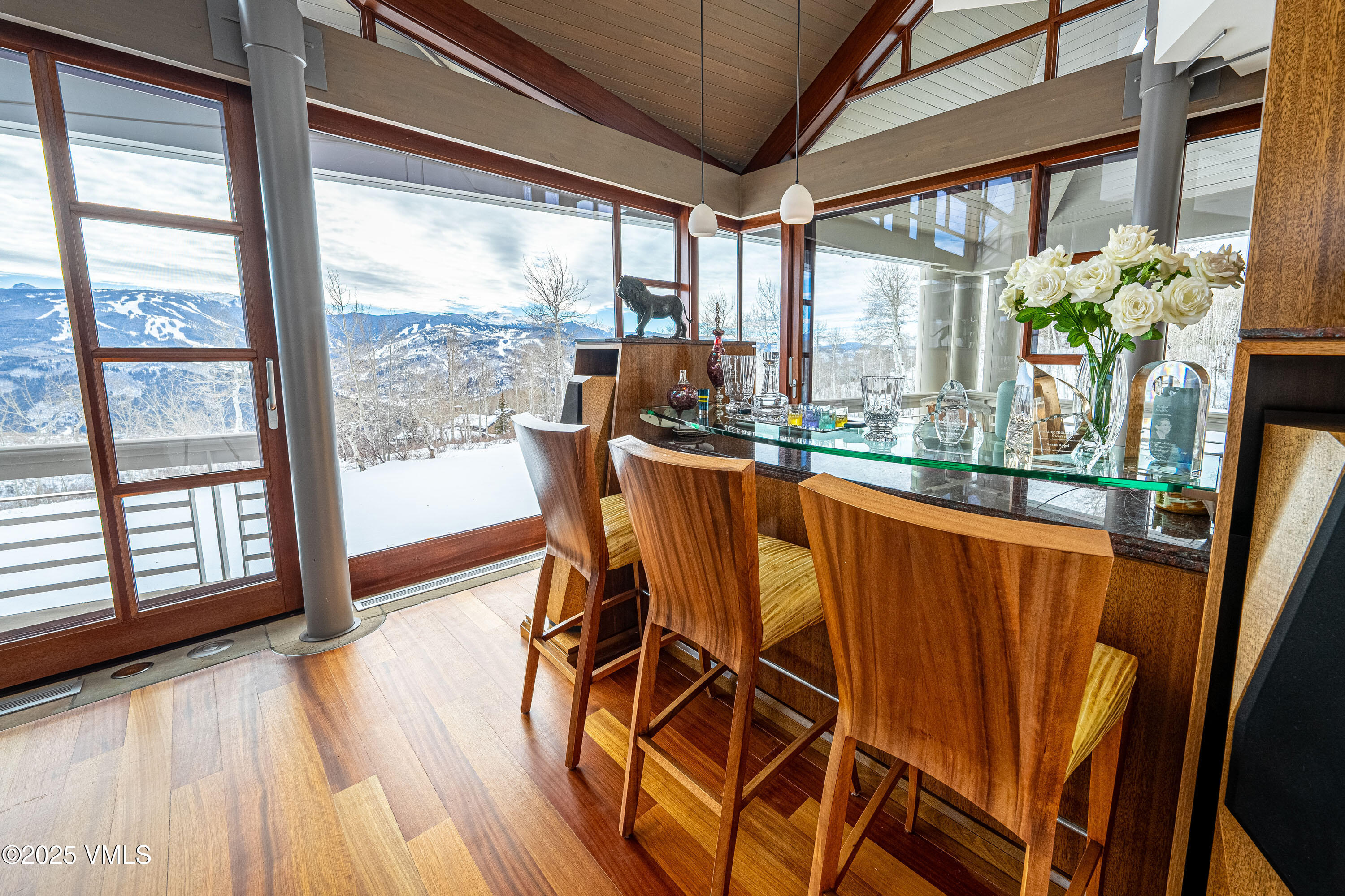 56 Rose Crown Avon, CO 81620 - Photo 9 of 39 a dining room with furniture water view and wooden floor