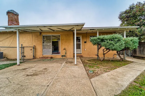 a house with trees in front of it