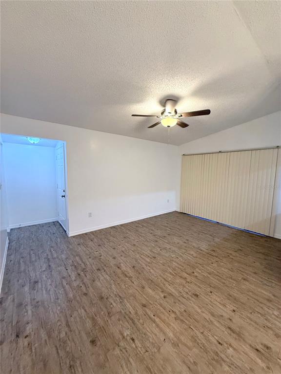 202 Riverbend Drive, Unit 201 Altamonte Springs, FL 32714 - Photo 6 of 13 wooden floor in an empty room