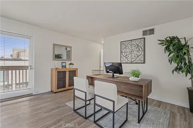 a workspace with furniture and window