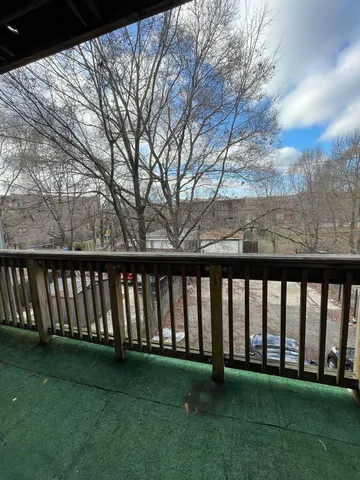 a view of yard with swimming pool and green space