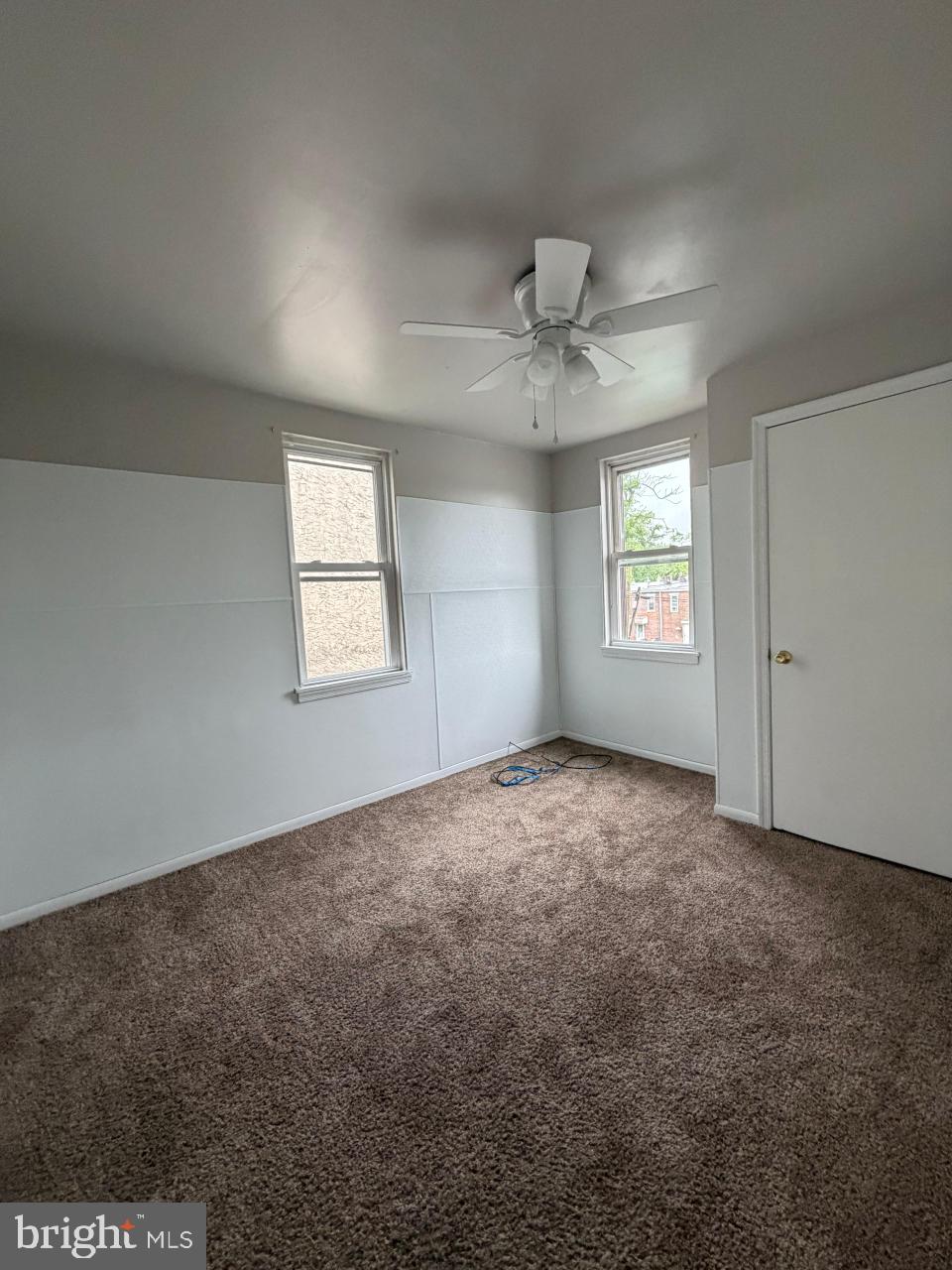 135 9th Street Brookhaven, PA 19015 - Photo 8 of 9 an empty room with windows and ceiling fan view