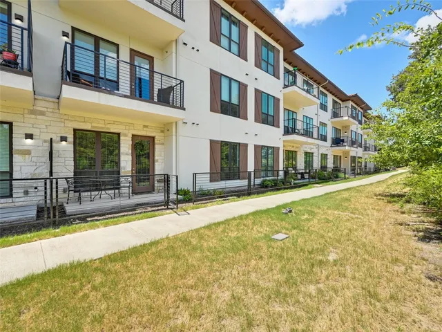 a view of building with a swimming pool