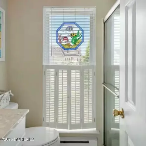 a bathroom with a toilet and a sink