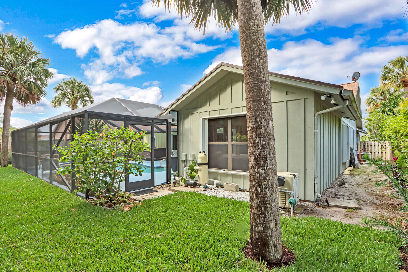 905 Sandy Oaks Drive Jupiter, FL 33477 - Photo 38 of 51 a front view of a house with garden