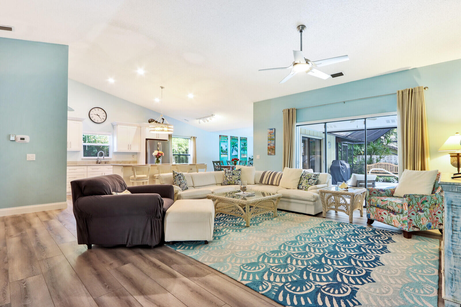 905 Sandy Oaks Drive Jupiter, FL 33477 - Photo 8 of 51 a living room with furniture dining area and a large window