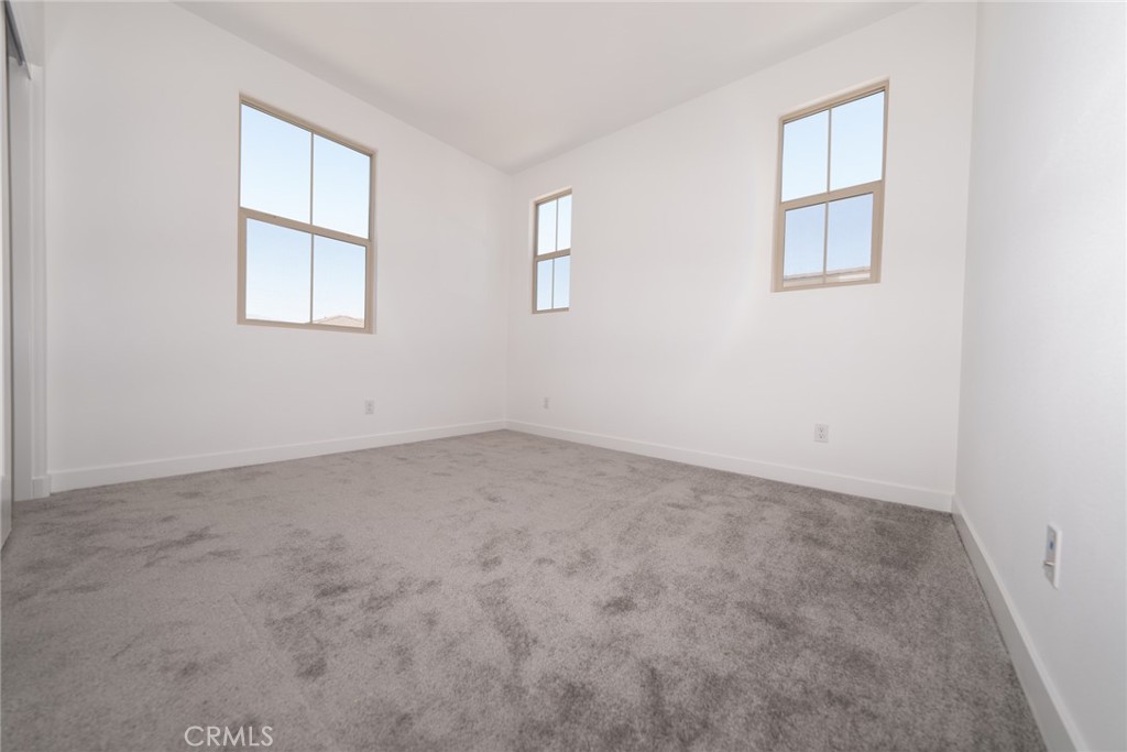 35878 McCarthy Street Palm Desert, CA 92211 - Photo 12 of 26 an empty room with windows