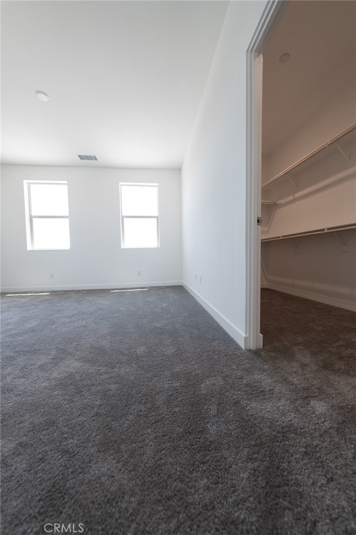 35878 McCarthy Street Palm Desert, CA 92211 - Photo 16 of 26 an empty room with windows