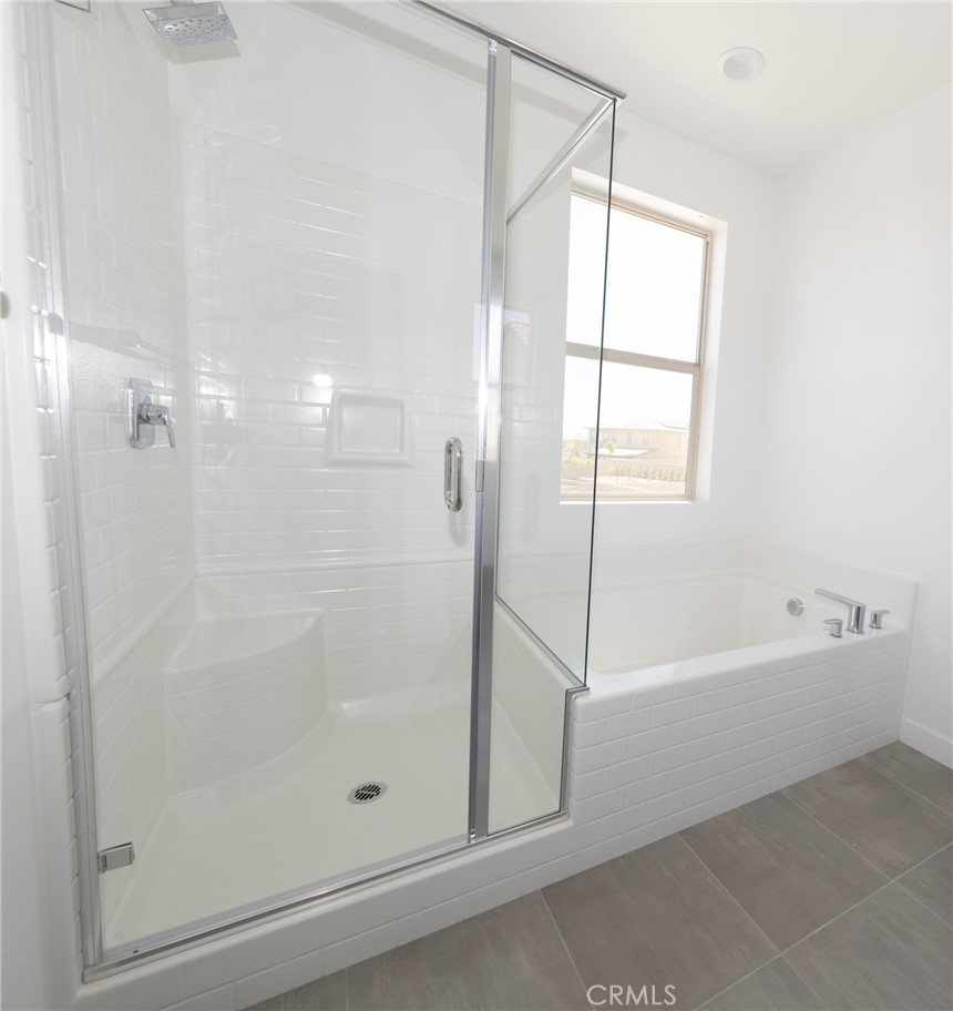 35878 McCarthy Street Palm Desert, CA 92211 - Photo 20 of 26 a bathroom with a bathtub and a shower