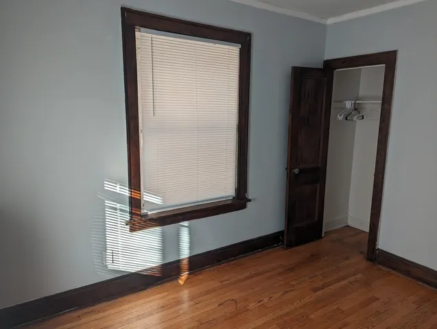 a view of front door with wooden floor