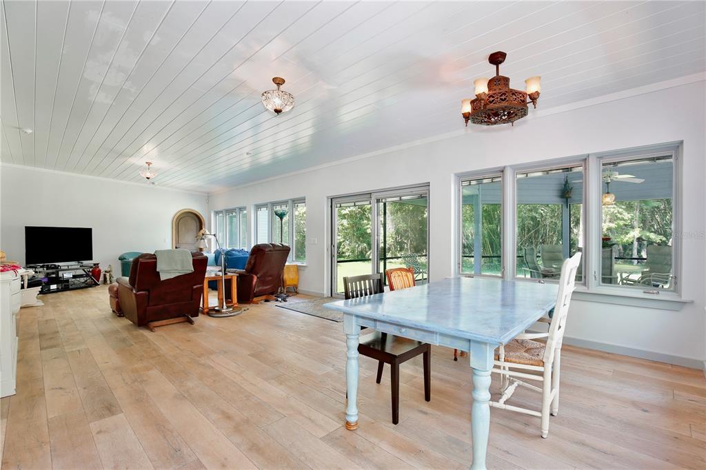 183 Parsons Road Longwood, FL 32779 - Photo 14 of 100 a living room with furniture a flat screen tv and a large window