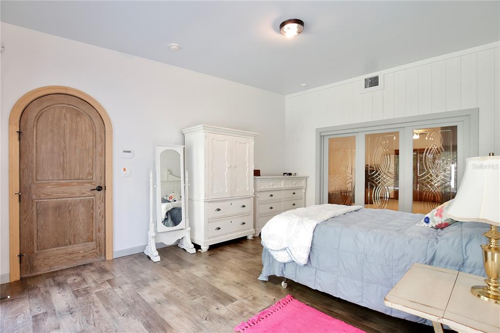 183 Parsons Road Longwood, FL 32779 - Photo 17 of 100 a bedroom with a bed and a dresser