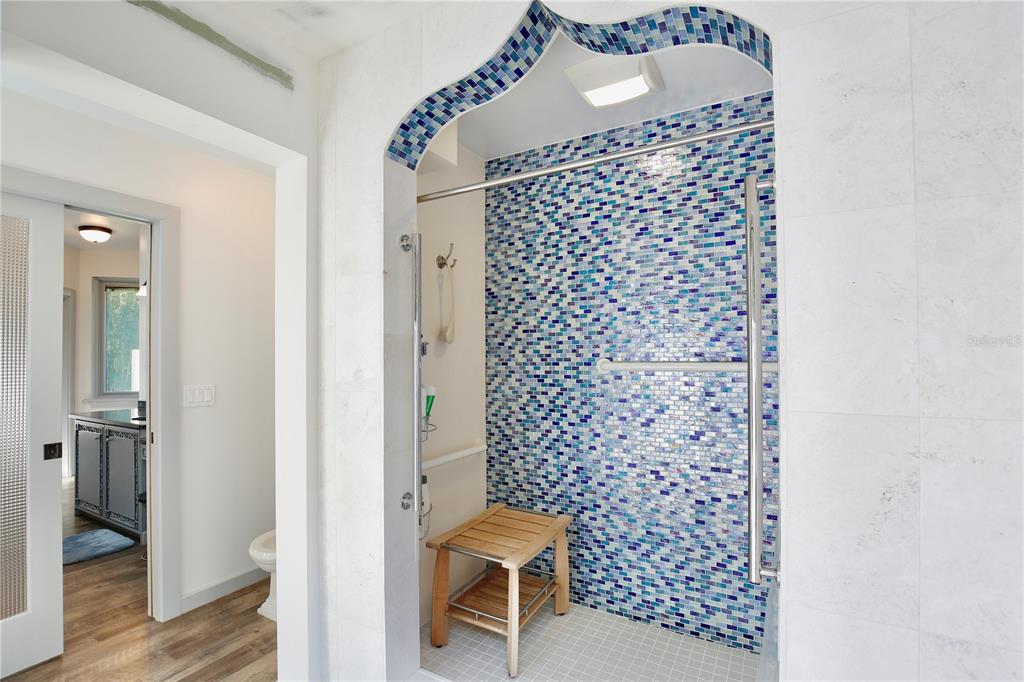 183 Parsons Road Longwood, FL 32779 - Photo 20 of 100 a bathroom with a toilet and a shower curtain