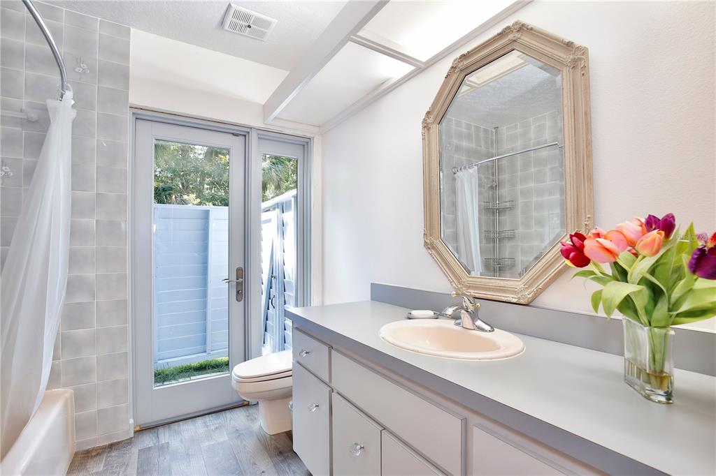 183 Parsons Road Longwood, FL 32779 - Photo 31 of 100 a bathroom with a granite countertop sink a toilet and a mirror
