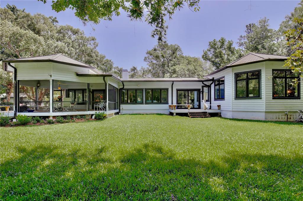 183 Parsons Road Longwood, FL 32779 - Photo 40 of 100 a view of a house with a backyard porch and sitting area