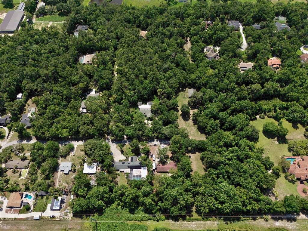 183 Parsons Road Longwood, FL 32779 - Photo 64 of 100 an aerial view of residential houses with outdoor space and trees