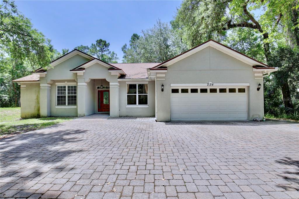 183 Parsons Road Longwood, FL 32779 - Photo 69 of 100 a view of a house with a yard and large trees