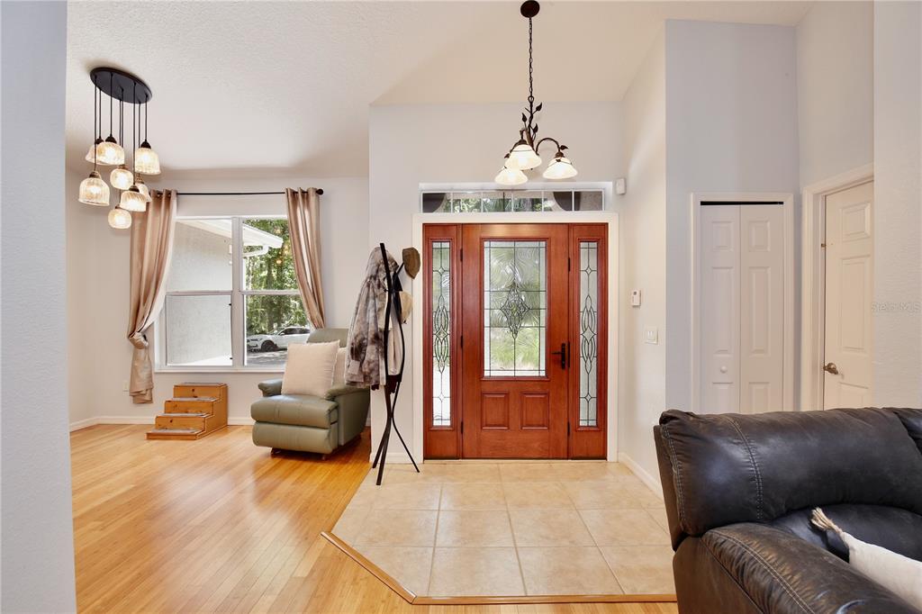 183 Parsons Road Longwood, FL 32779 - Photo 71 of 100 a living room with furniture a chandelier and a chandelier