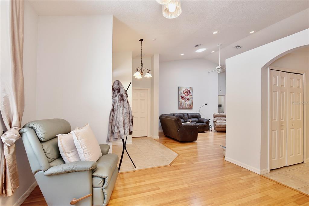 183 Parsons Road Longwood, FL 32779 - Photo 72 of 100 a living room with furniture and a chandelier
