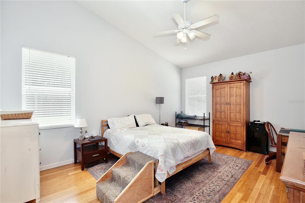 183 Parsons Road Longwood, FL 32779 - Photo 81 of 100 a bedroom with a bed and wooden floor