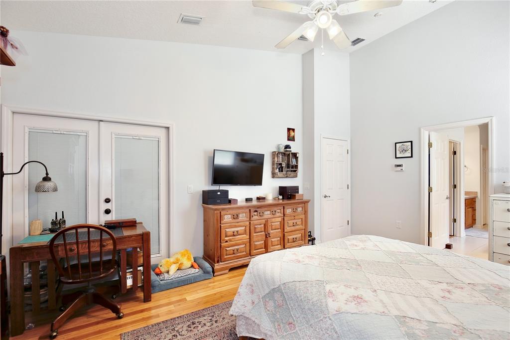 183 Parsons Road Longwood, FL 32779 - Photo 82 of 100 a bedroom with a bed and a flat screen tv