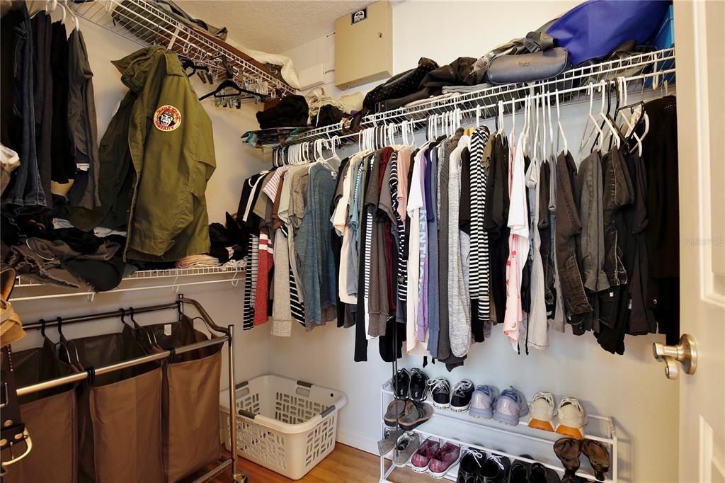 183 Parsons Road Longwood, FL 32779 - Photo 85 of 100 a view of walk in closet with clothes and shoes